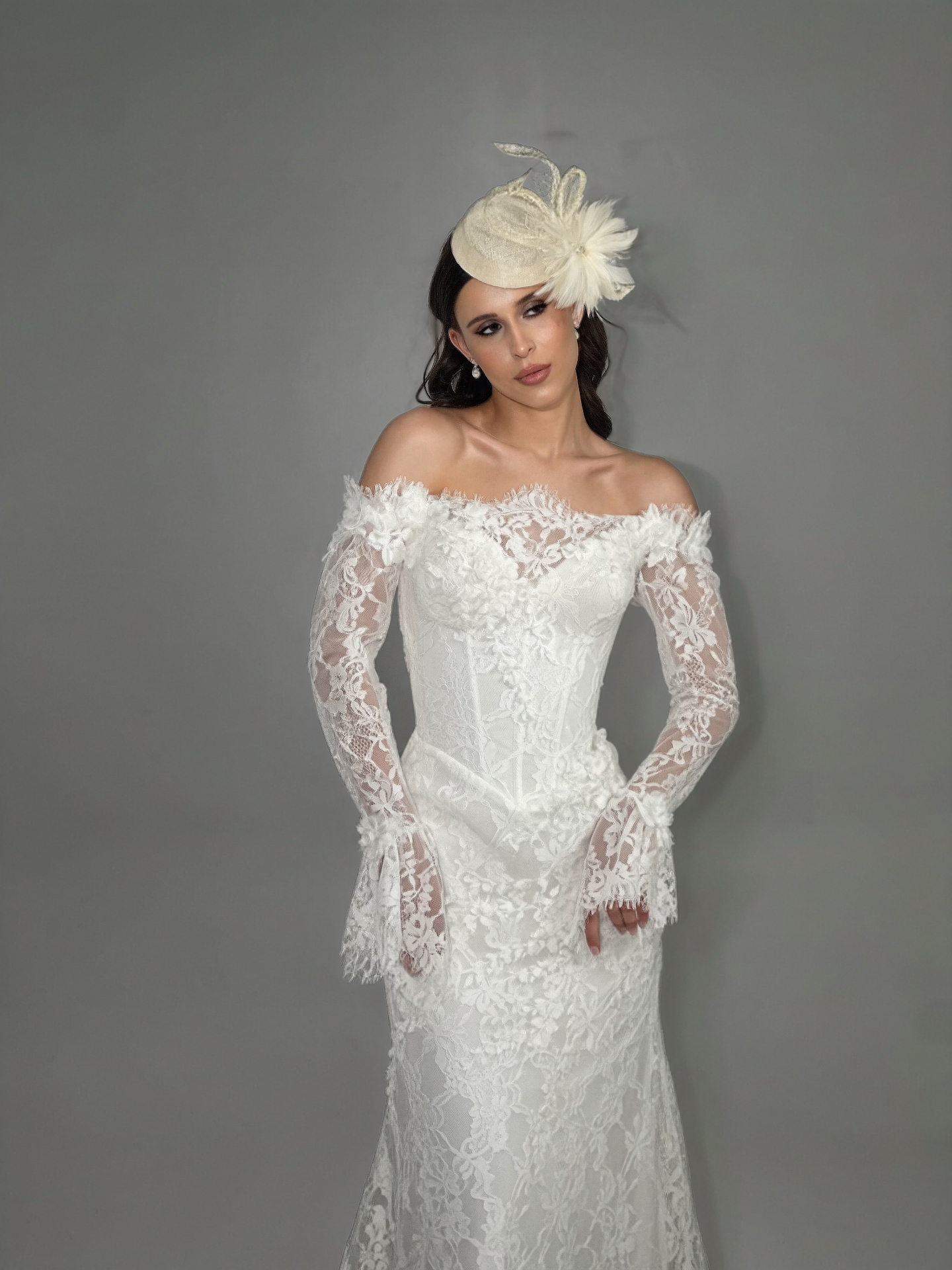 Viola — detailed view of fitted lace silhouette with long flared sleeves