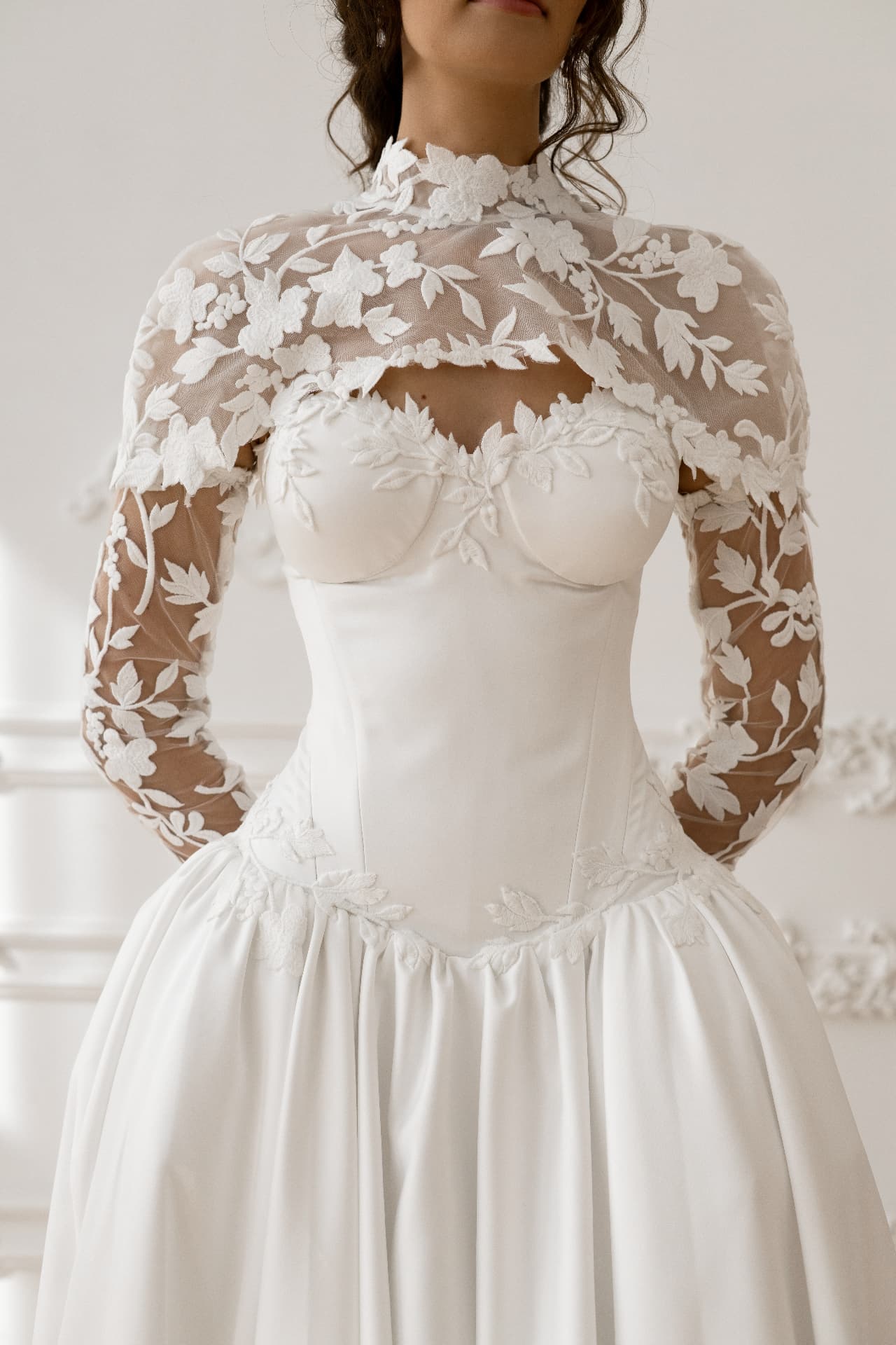 Athena — close-up of the sculpted corset bodice and floral appliqués