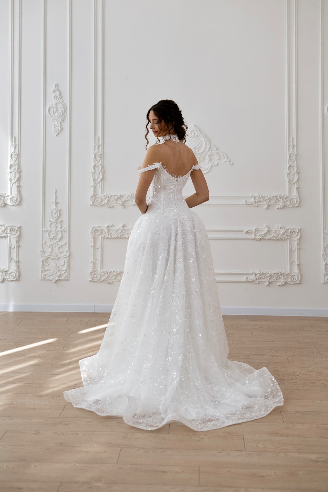 Artemis — back view with fitted corset bodice and extended train