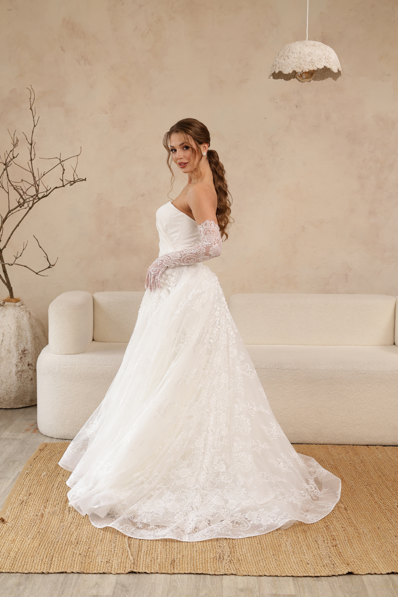 Polina — side view of voluminous lace skirt and detachable gloves