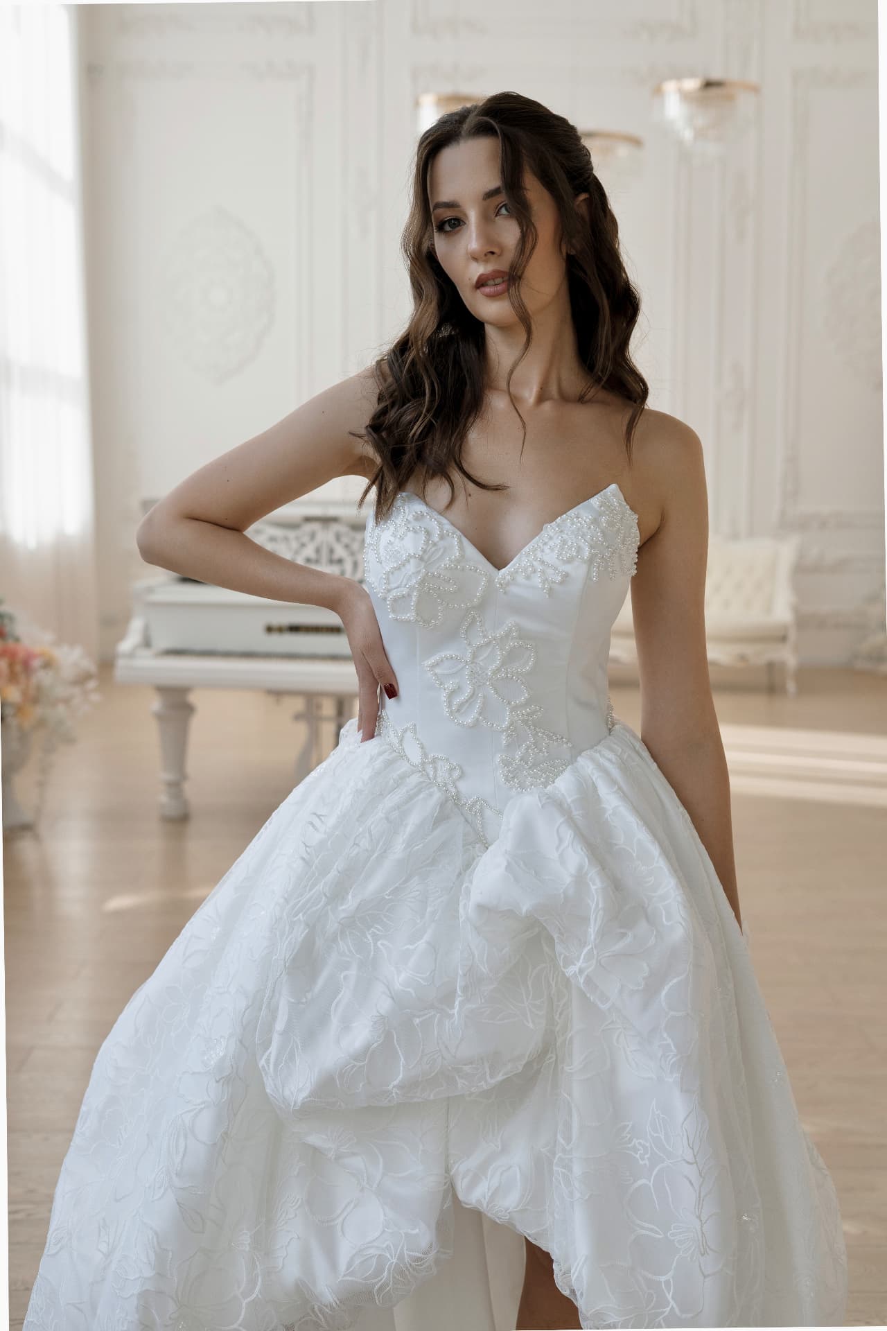Eos — floral appliqué corset and high-low skirt detail