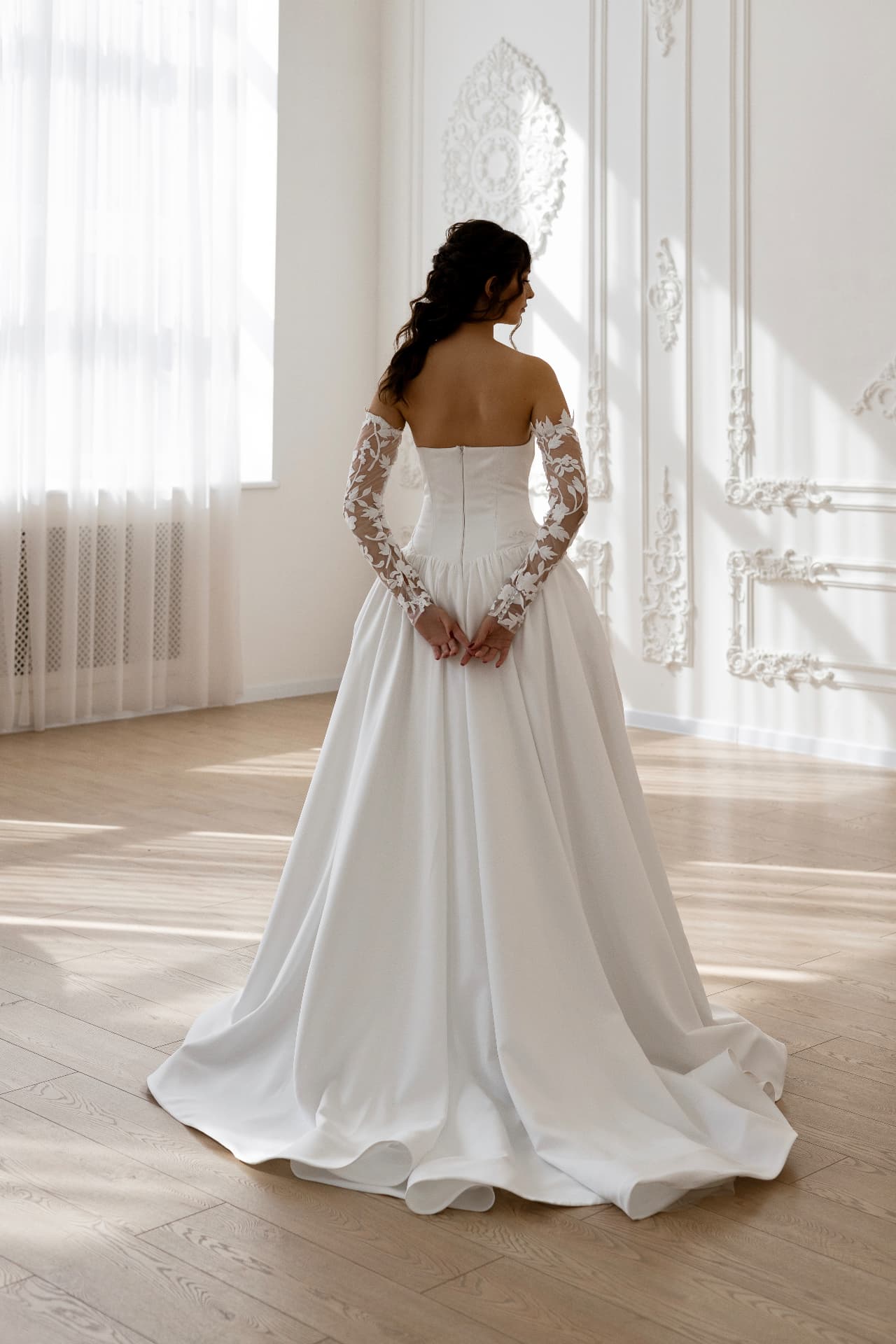 Athena — back view with lace sleeves and flowing train