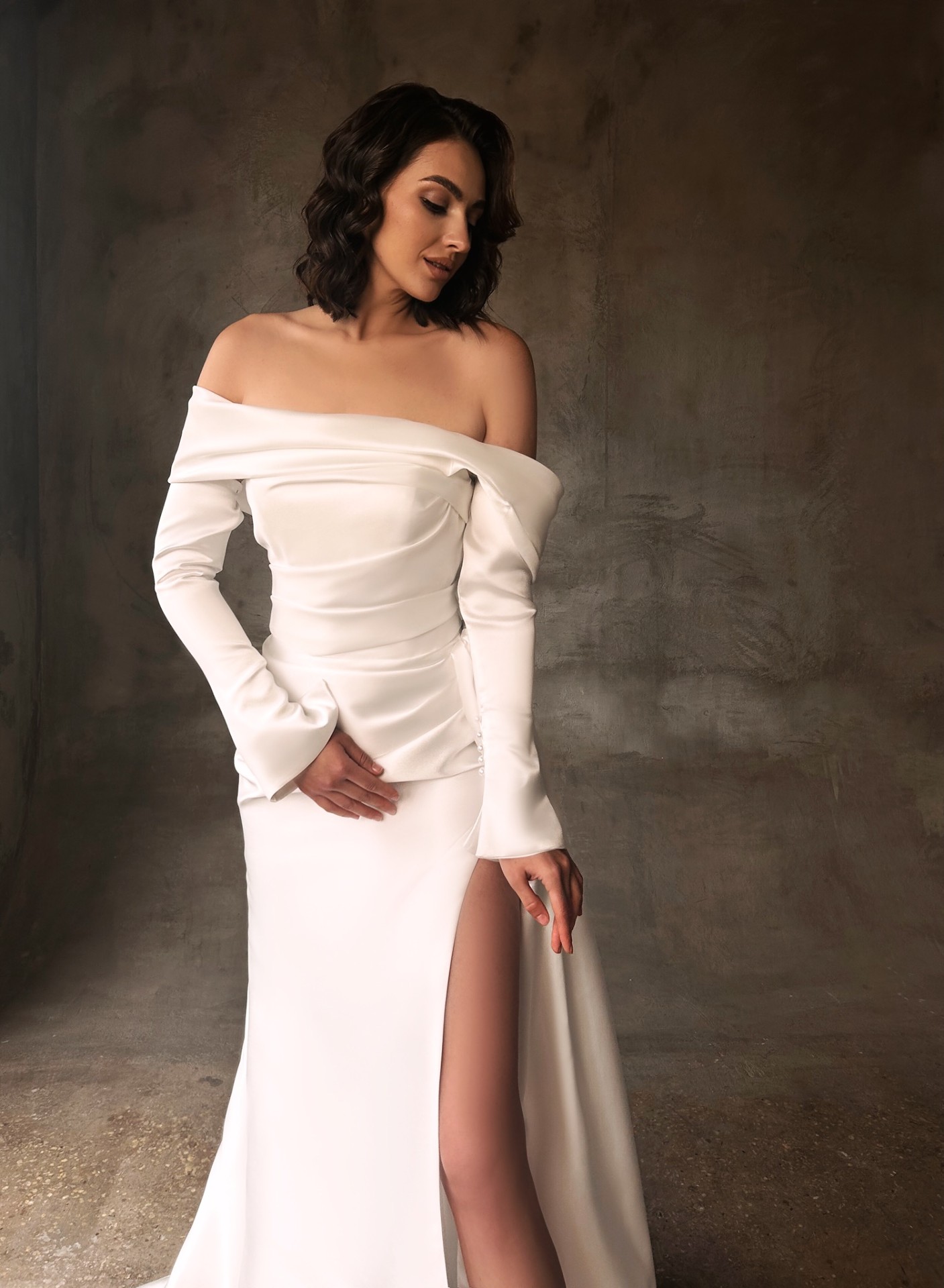 Jennifer — detail of structured satin bodice with cuffed sleeves and high leg slit
