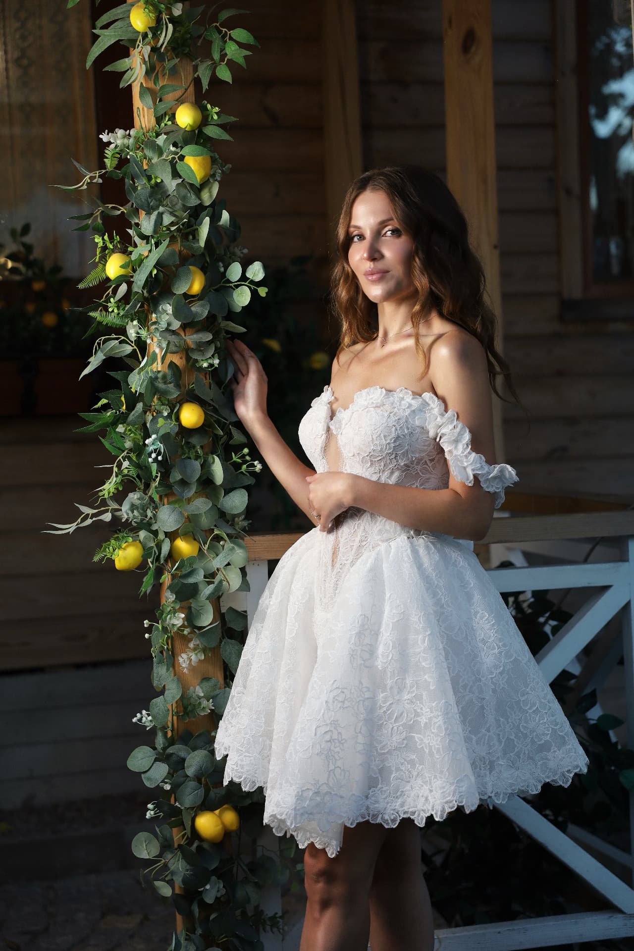 SATIN — three-quarter view, off-the-shoulder straps framing the décolletage