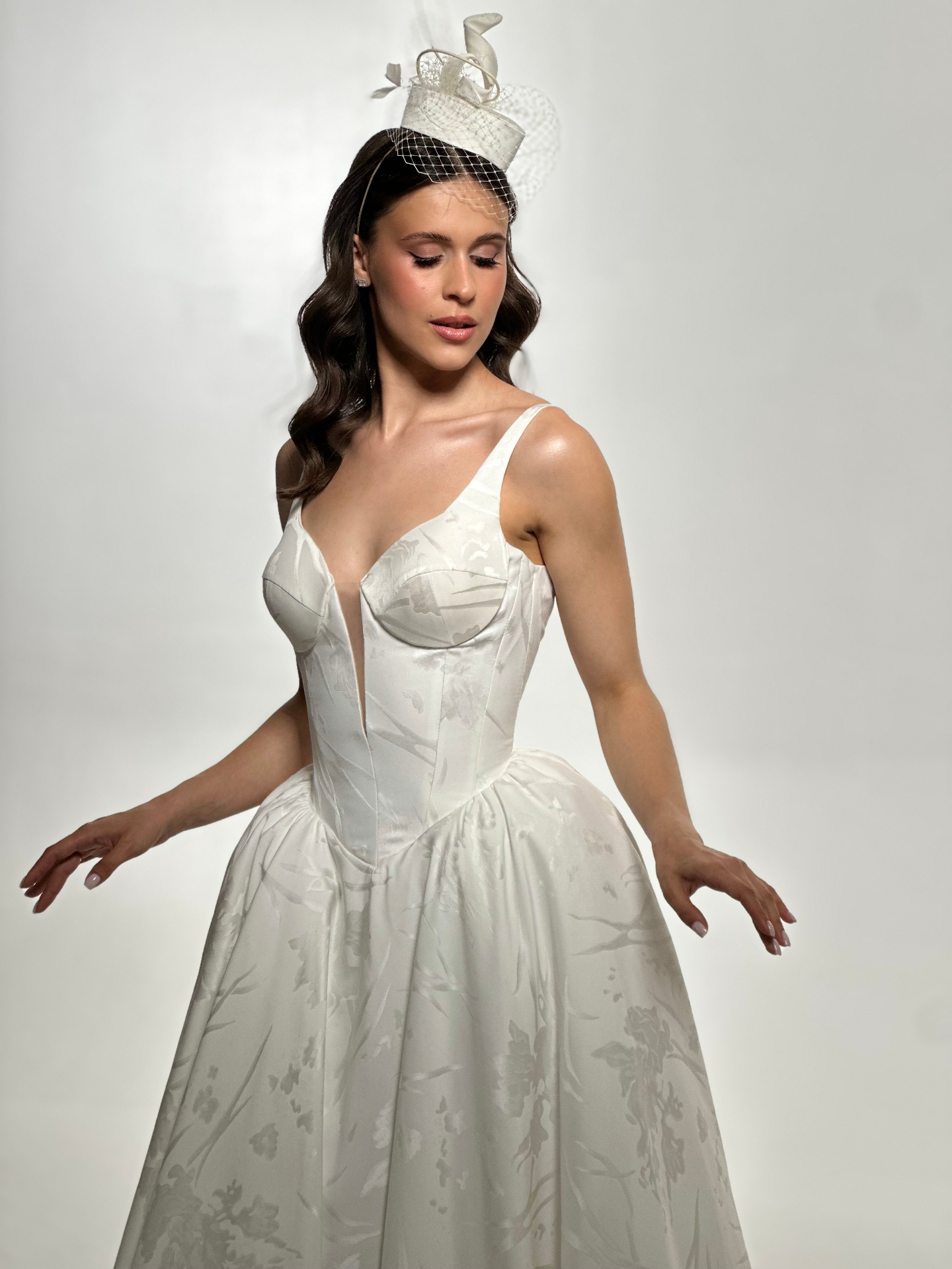 Angelina — close-up of structured corset bodice with subtle floral jacquard texture