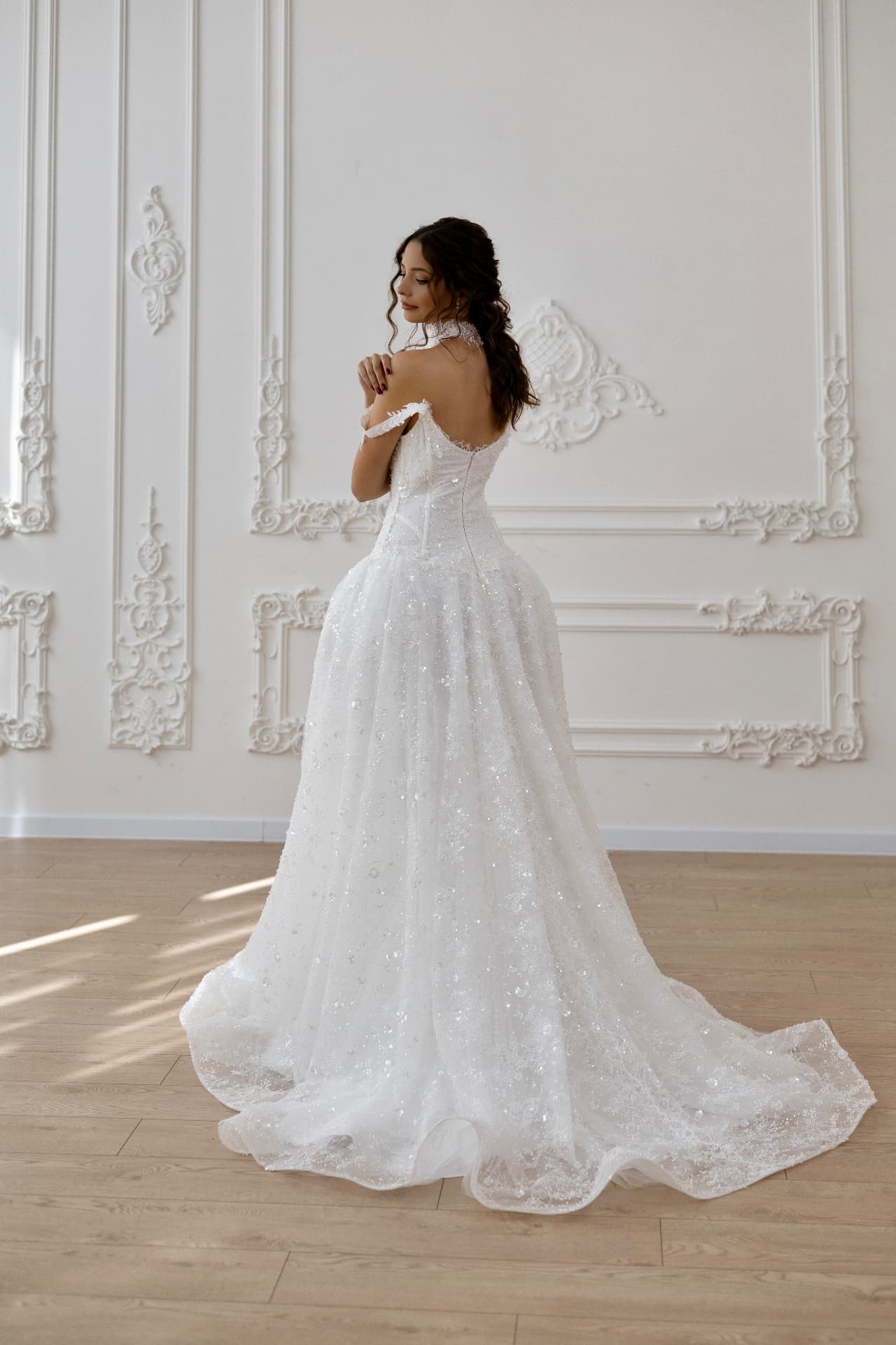 Artemis — three-quarter back view with low-cut back and sparkling skirt