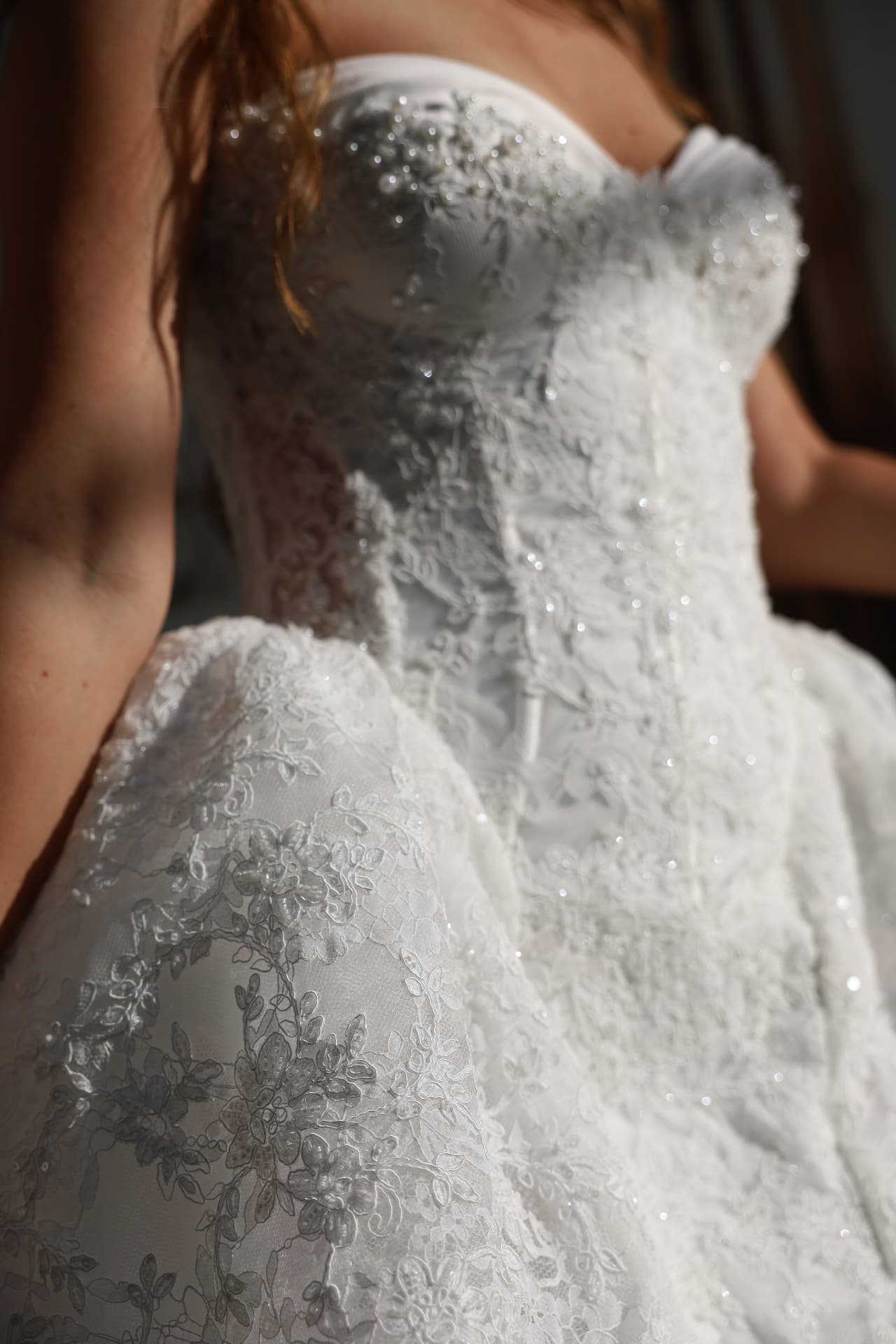 Bliss — detail of the floral lace appliqué on the corset bodice