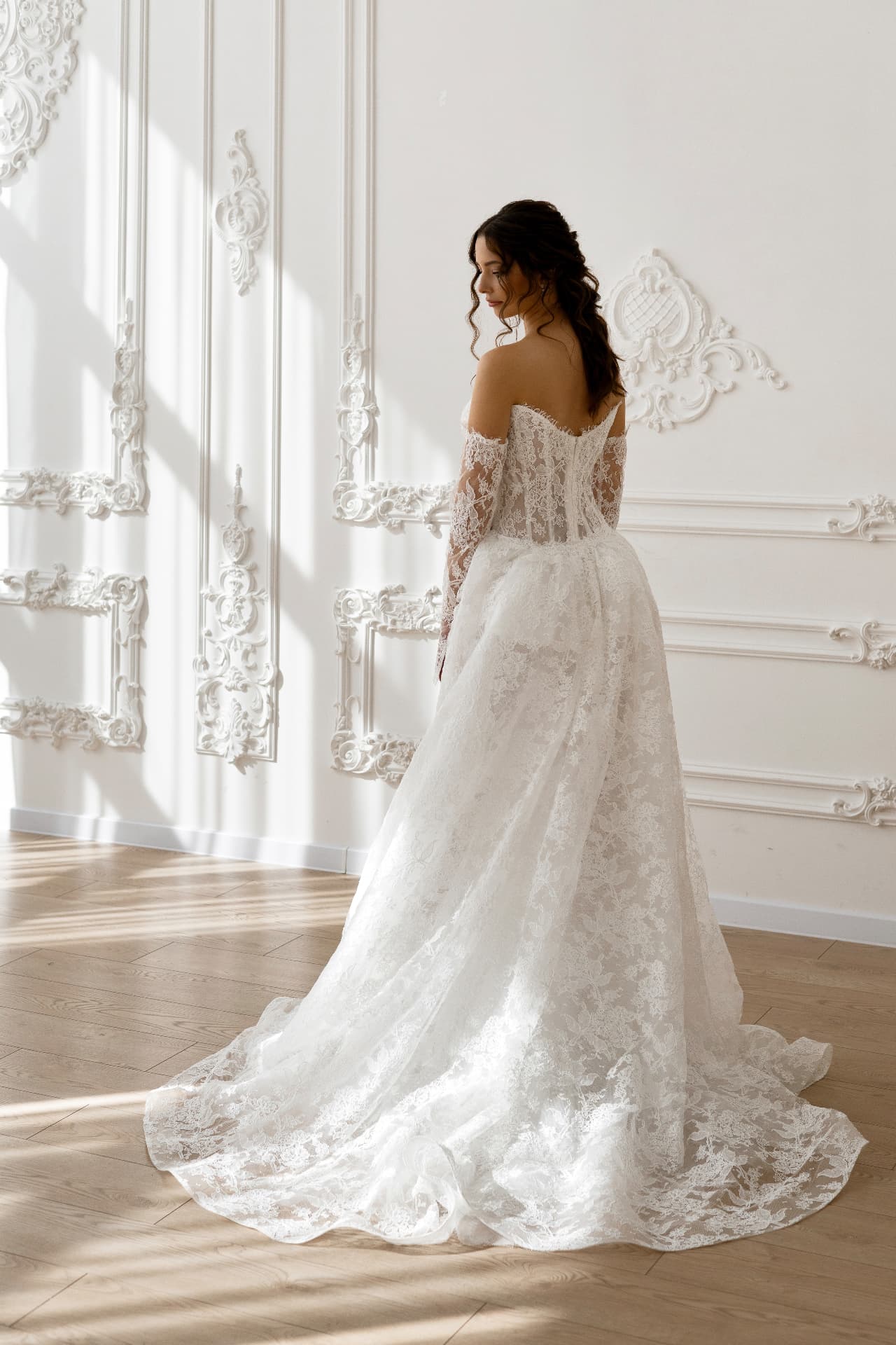 Gaia — full back view with lace skirt and graceful train