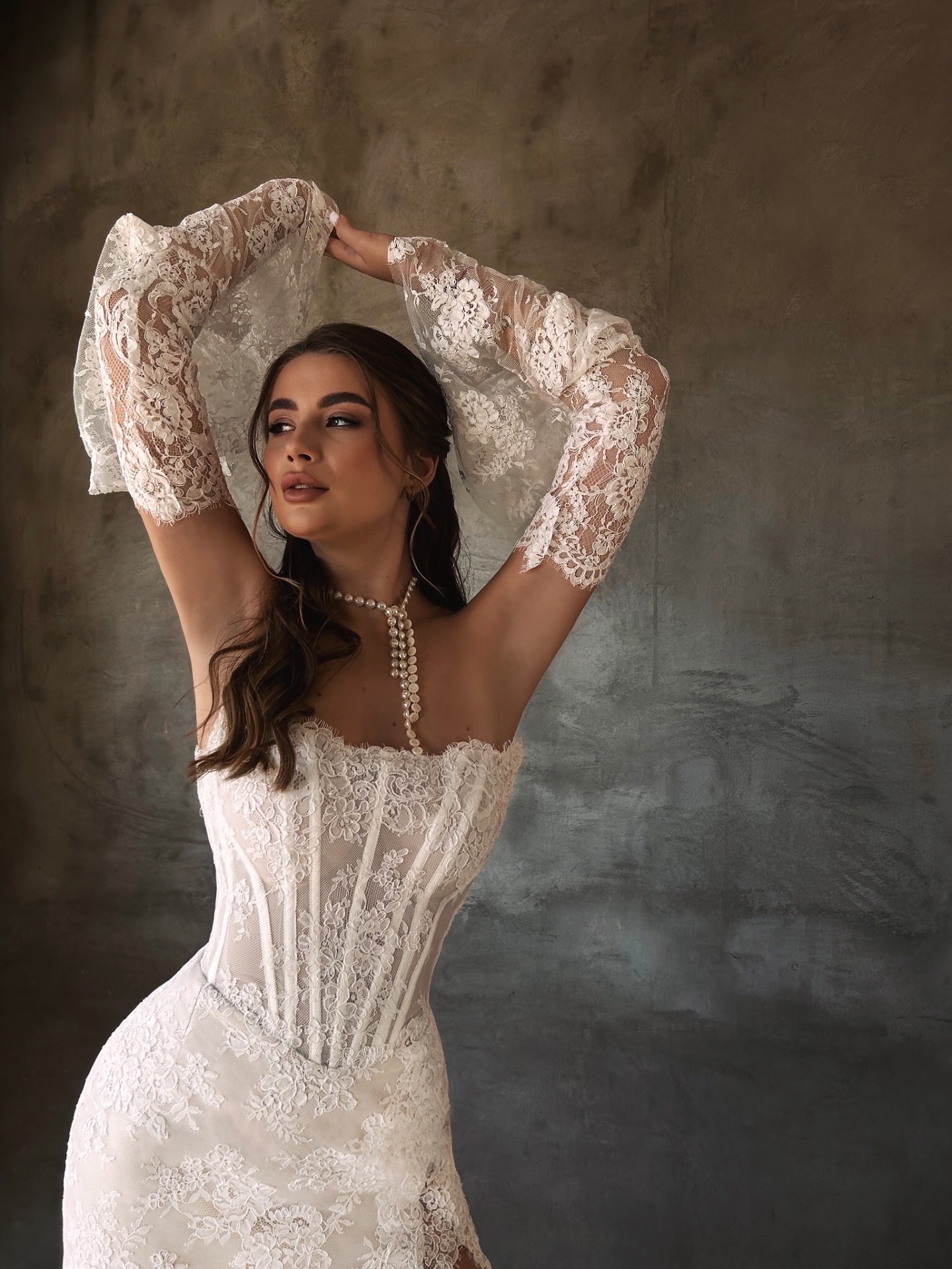 Patricia — close-up of the boned lace corset bodice and intricate flared lace sleeves