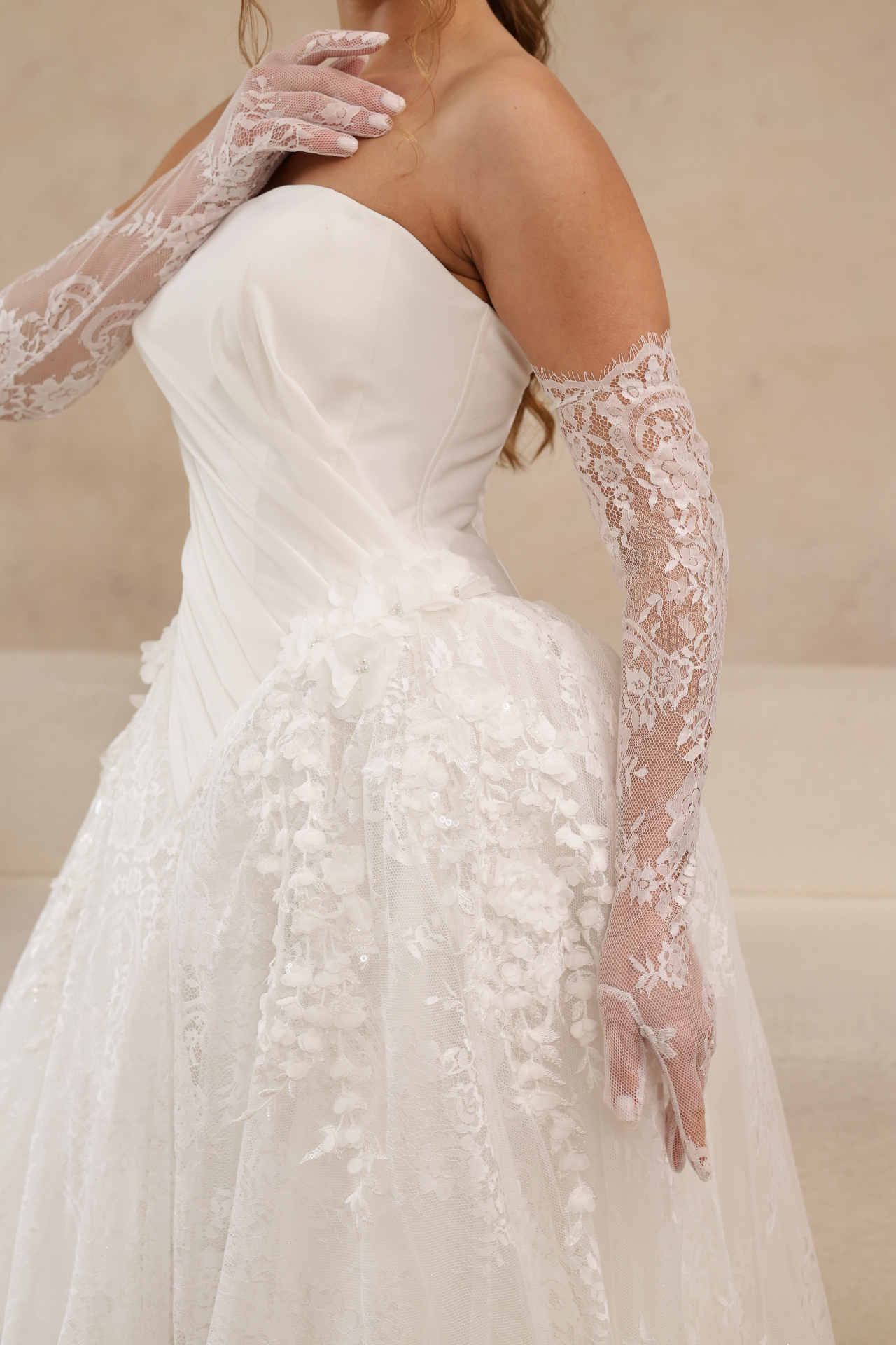 Polina — close-up of diagonally draped bodice and floral lace details