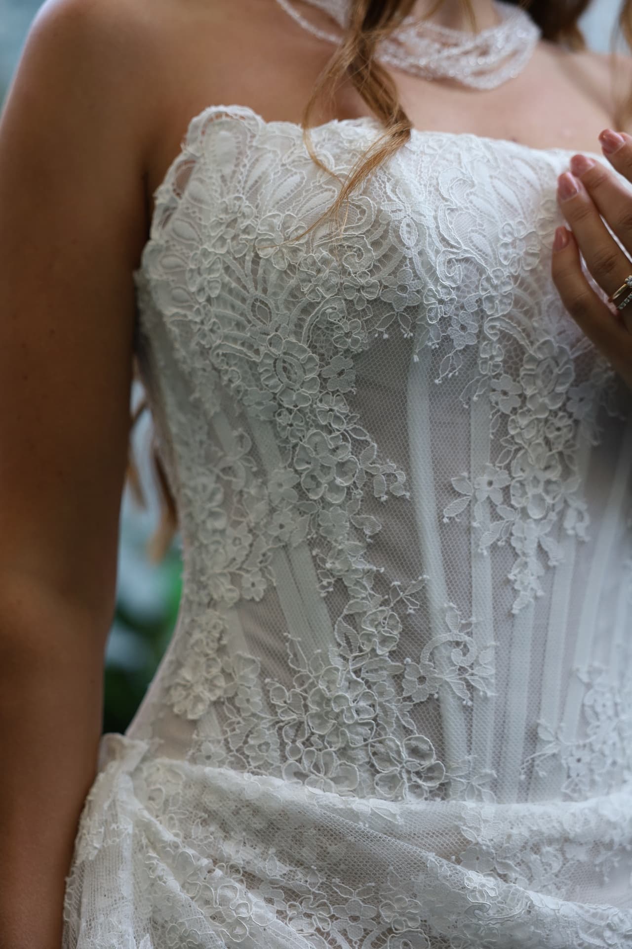 MIDNIGHT — detail of the structured lace corset bodice with a straight neckline