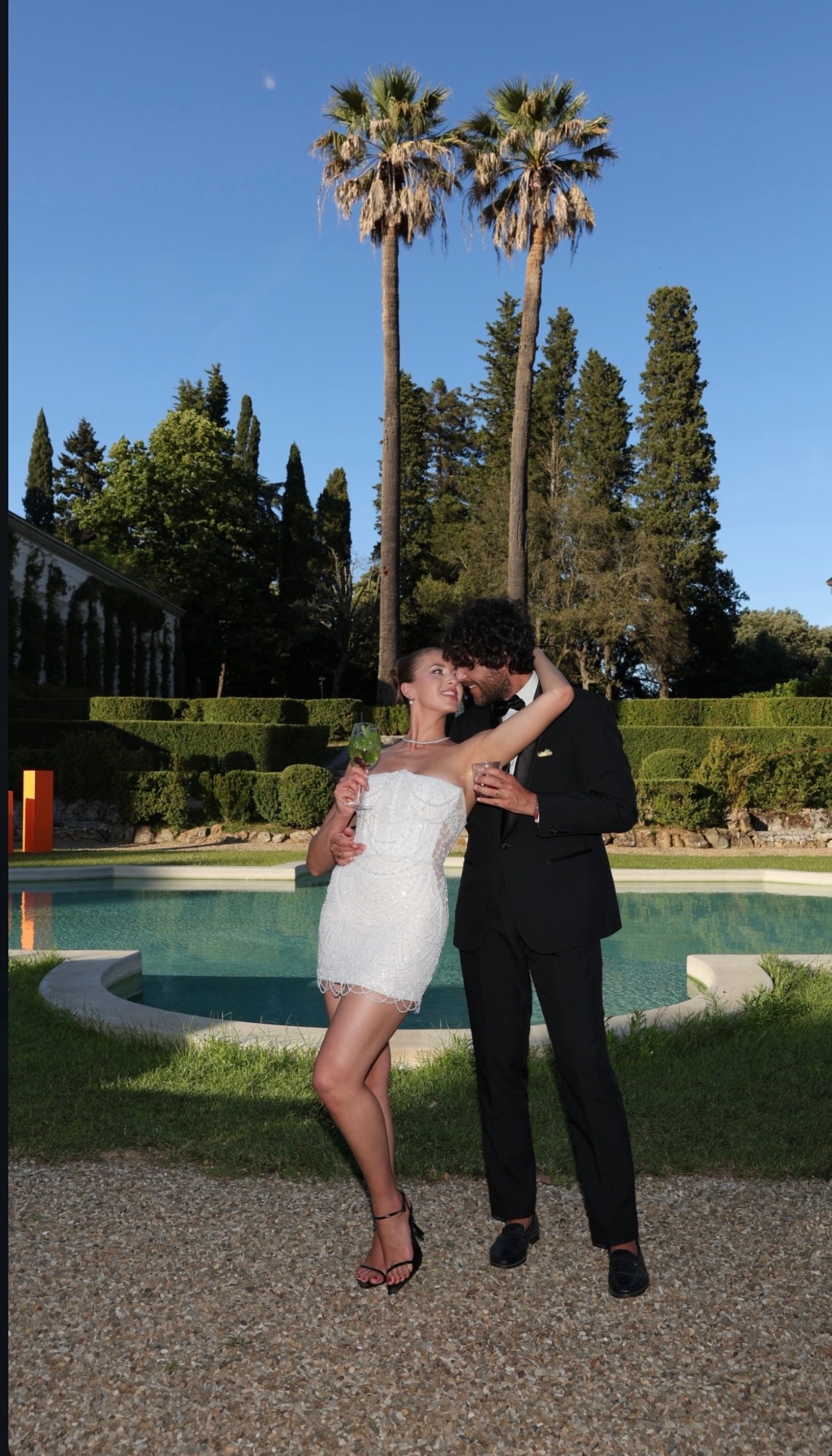 Jenny — couple portrait featuring the strapless beaded mini bridal dress
