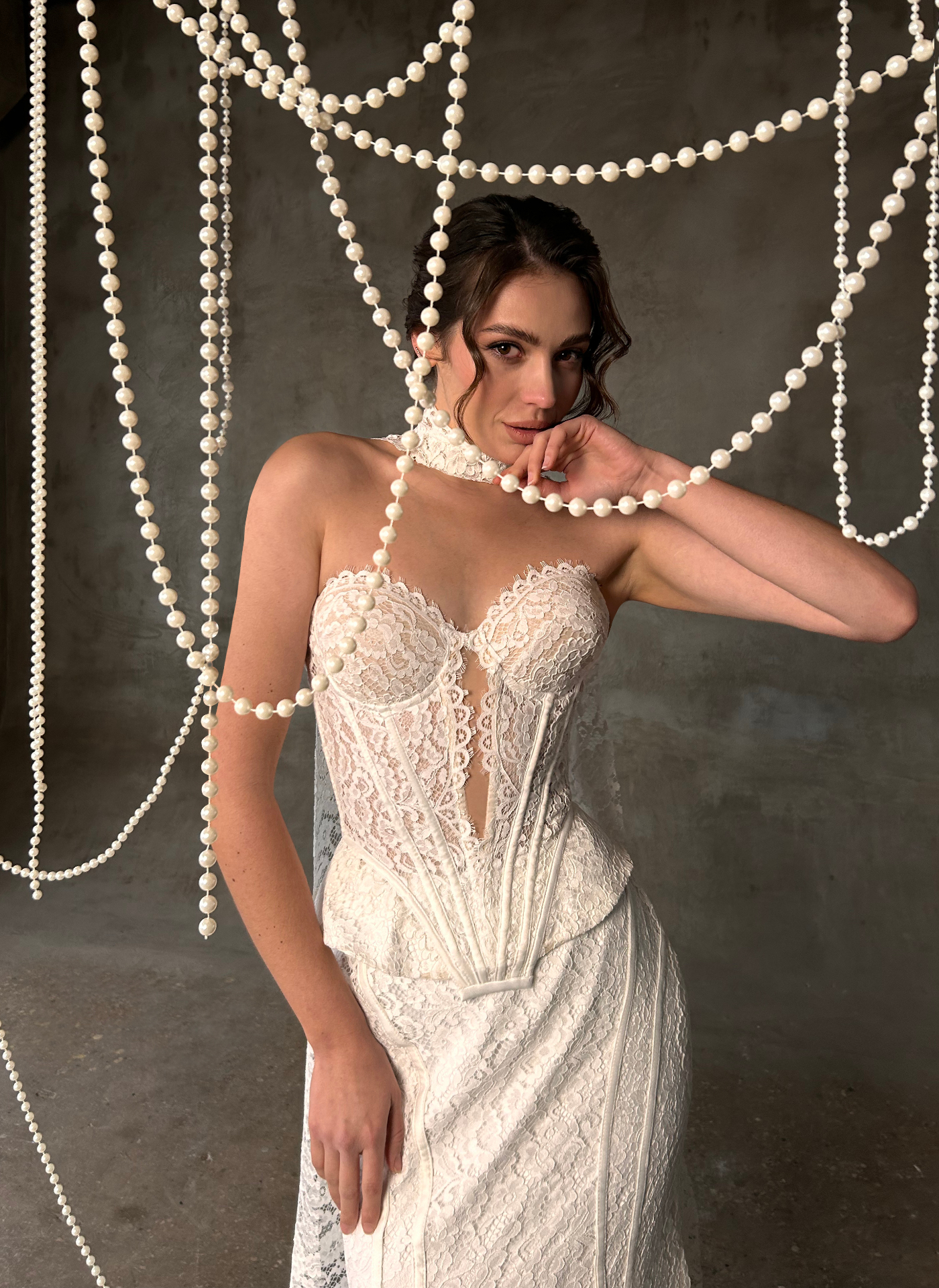 Odette — front detail of the avant-garde mermaid silhouette with sculpted strapless corset, lace peplum and pearl draping