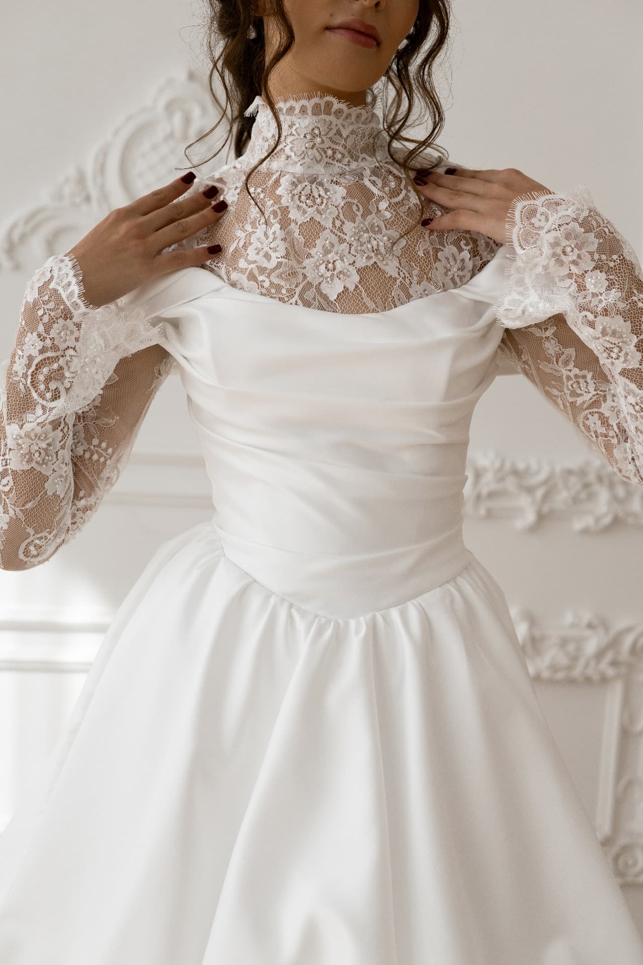 Hecate — close-up of the lace bodice and off-the-shoulder satin neckline