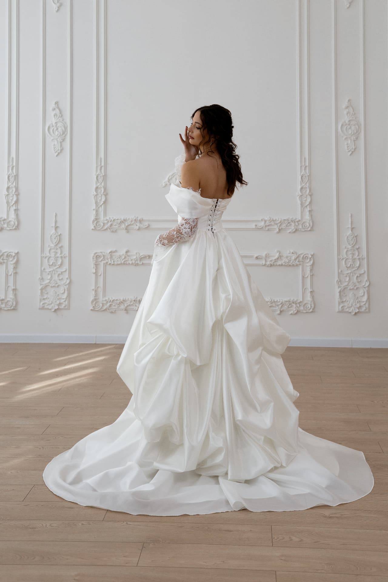Aphrodite — back view with lace-up corset and wide draped train