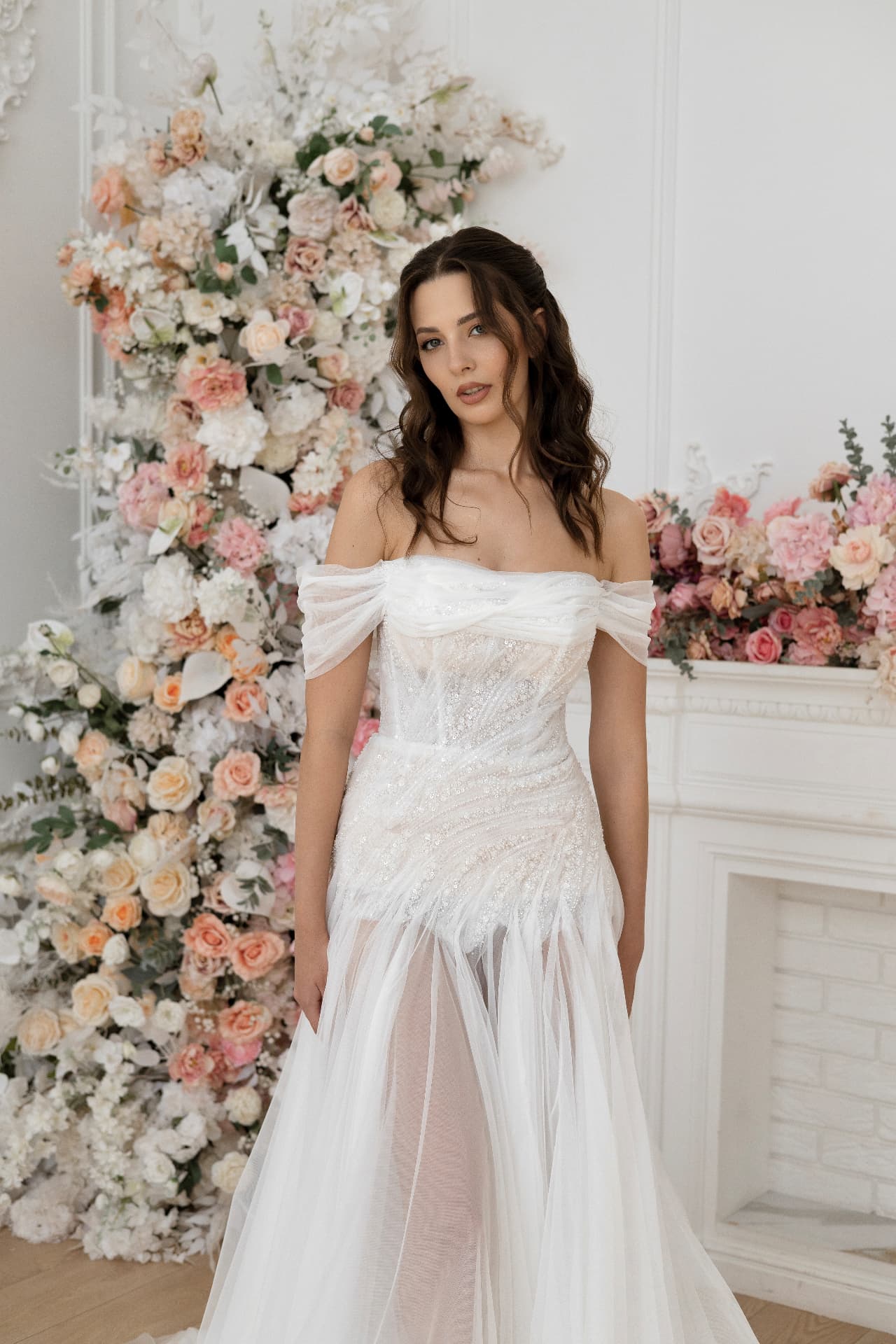 Hera — portrait showing the off-the-shoulder neckline and draped sleeves