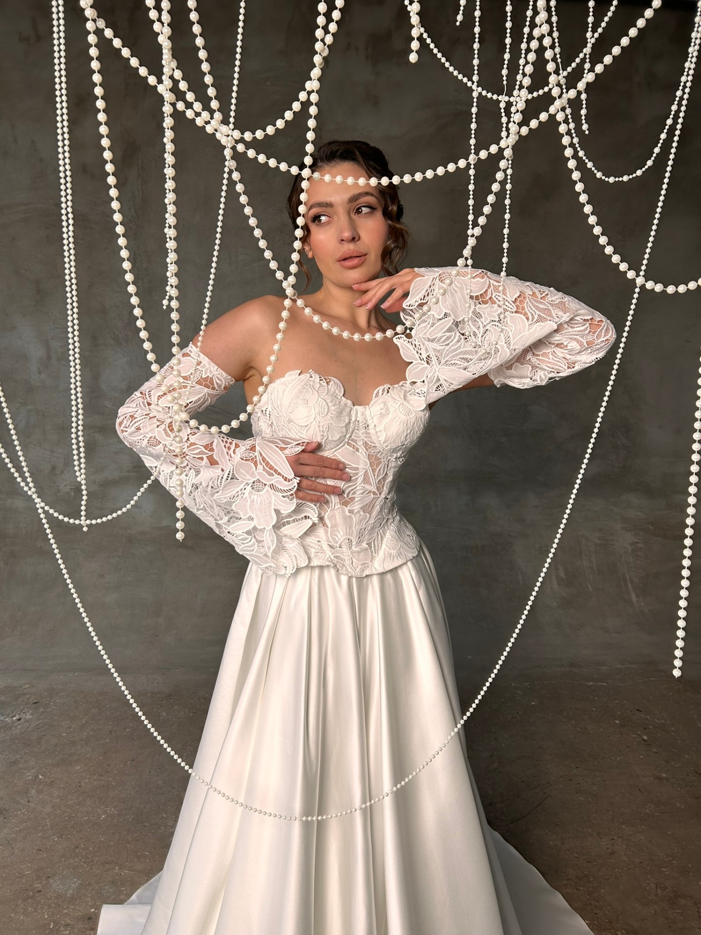 Penelope — close-up of the sheer floral lace corset bodice with sweetheart neckline and dramatic flared lace sleeves