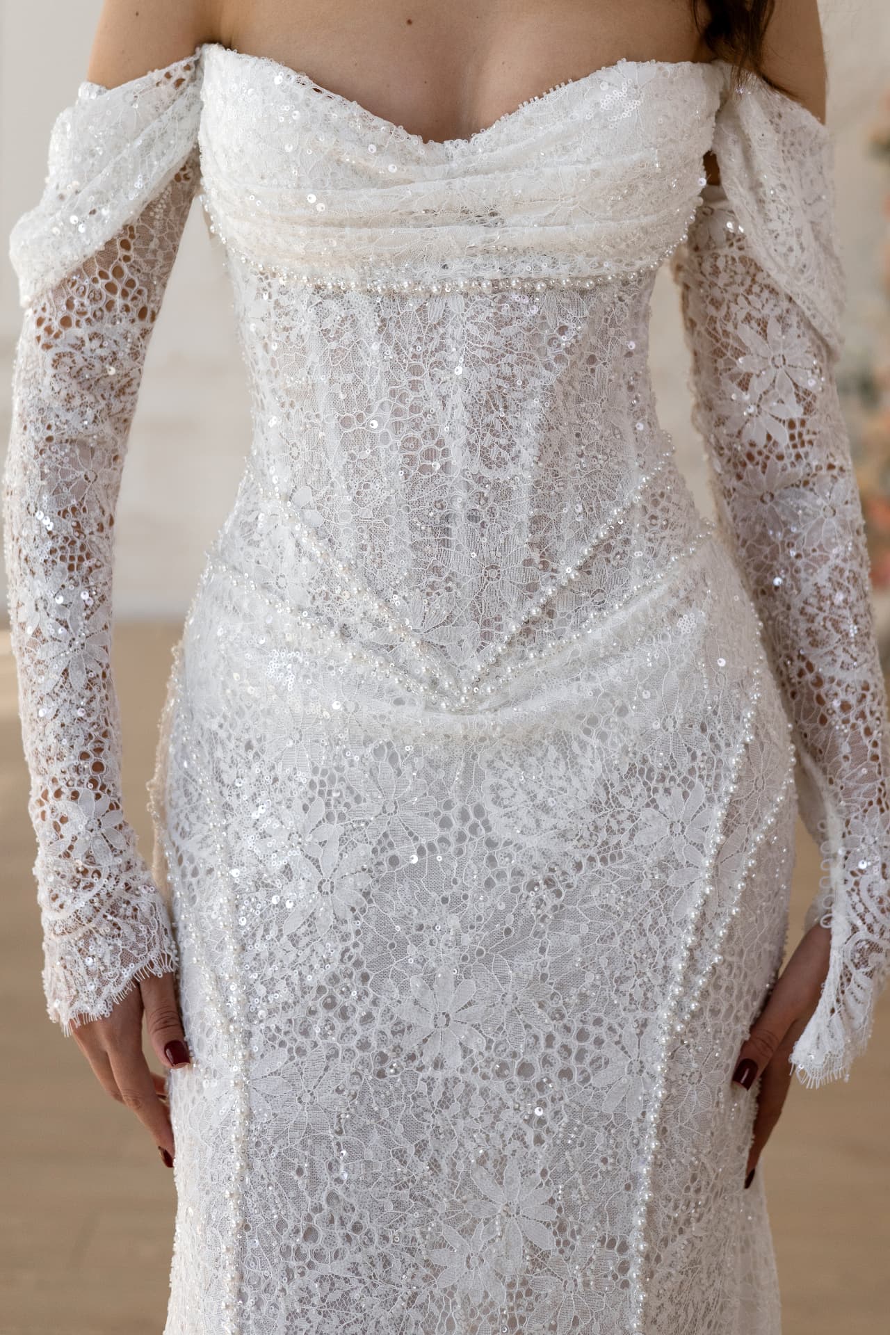 Persephone — close-up of the floral lace bodice and embellished waist